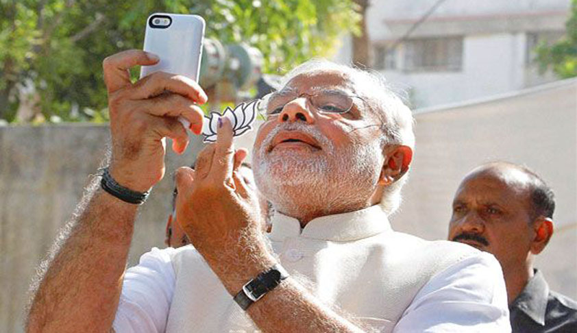 Gujarat High Court recalls order of admitting petition against PM Modi for Poll Code Breach, clicking selfie with BJP Lotus Gujarat High Court recalls order of admitting petition against PM Modi for Poll Code Breach, clicking selfie with BJP Lotus