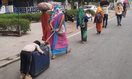 Sufferings Of Migrant Labourers Not Coming To A Halt : NHRC Takes Cognizance Of Mother Pulling Suitcase With Exhausted Kid Sleeping On Sufferings Of Migrant Labourers Not Coming To A Halt : NHRC Takes Cognizance Of Mother Pulling Suitcase With Exhausted Kid Sleeping On