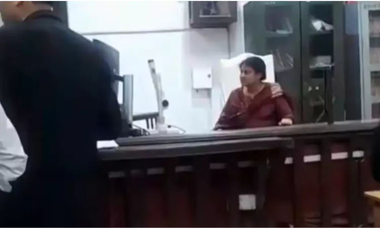 Woman Occupies District Judges Chair In Varanasi Court, Attempts To Conduct Hearings; Removed By Police Woman Occupies District Judges Chair In Varanasi Court, Attempts To Conduct Hearings; Removed By Police