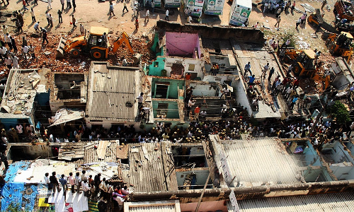 Slum Development Schemes To Rehabilitate Encroachers On Same Land A Mockery Of Public Trust Doctrine; Must Be Done Away With: Bombay HC